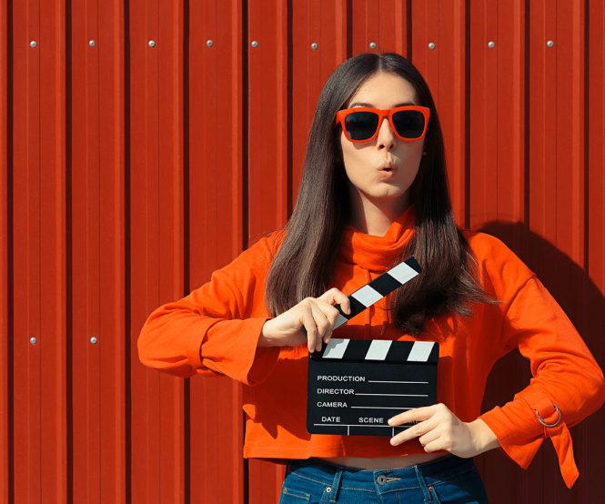 girl with movie clapboard