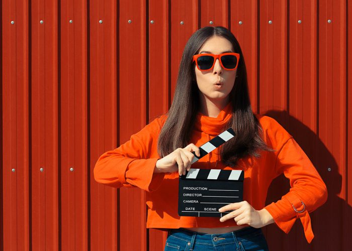 girl with movie clapboard